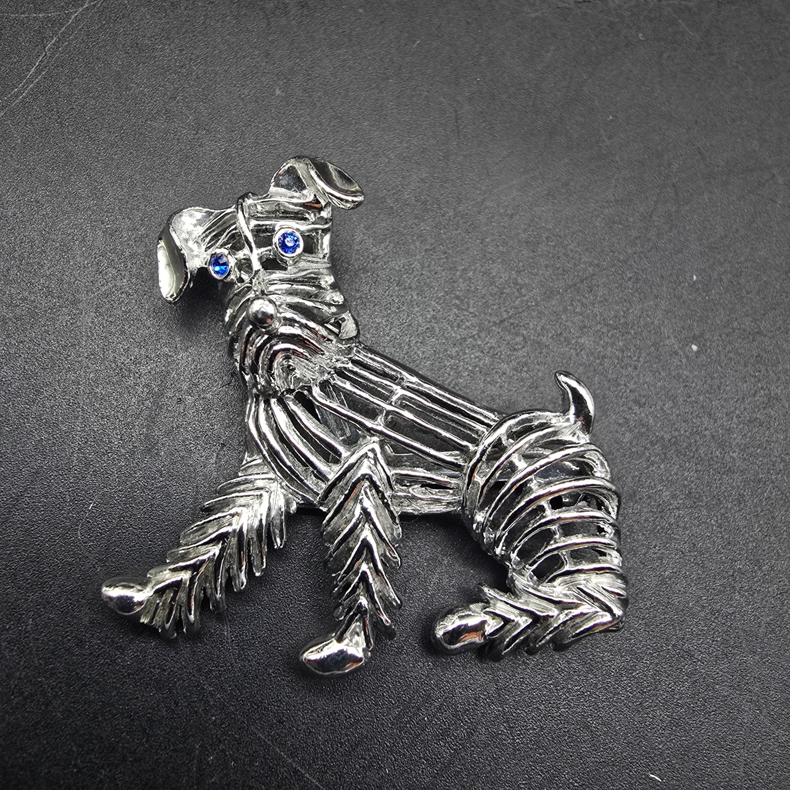 Gerry's Silver Tone Dog Brooch With Blue Rhinestone Eyes